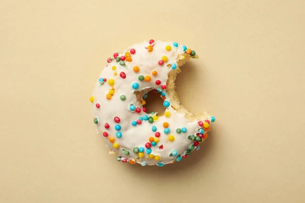 Tasty Bitten Donut Beige Background Top View — Stock Photo, Image