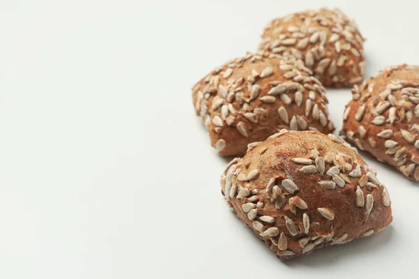 Fresh baked buns with sunflower seeds on white background — Stock Image Fresh Baked Buns Sunflower Seeds White Background Royalty Free Stock Photos