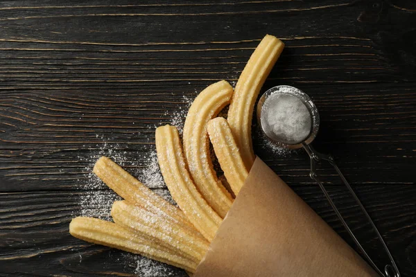 Churros Dulces Azúcar Polvo Sobre Fondo Madera —  Fotos de Stock