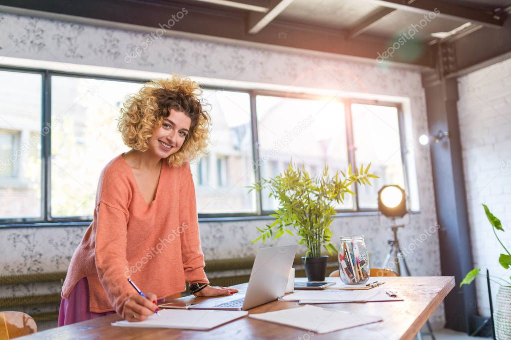 Portrait of confident creative businesswoman in office