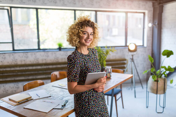 Portrait of confident creative businesswoman in office