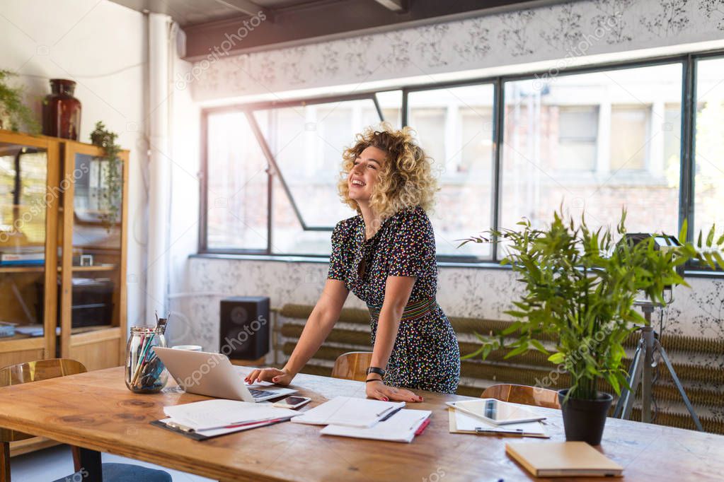 Portrait of confident creative businesswoman in office