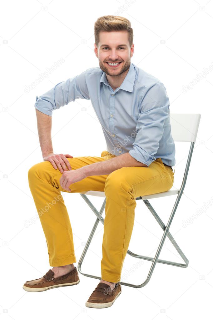 Young man sitting on a chair