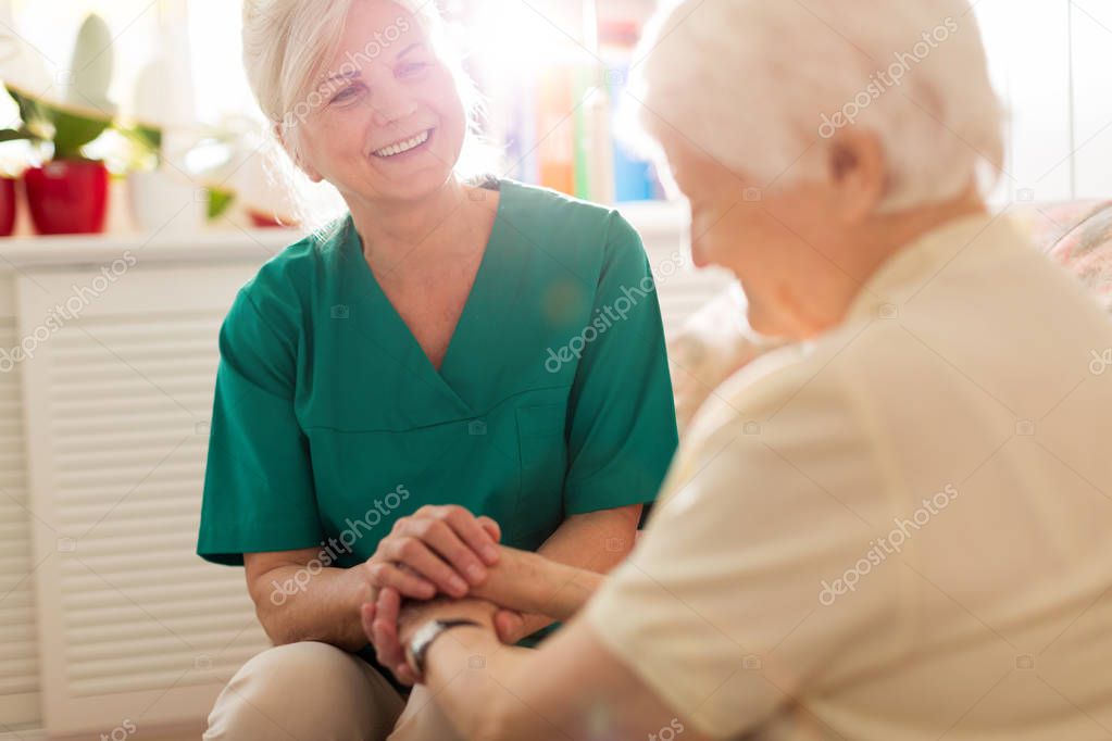 Senior woman with her female caregiver