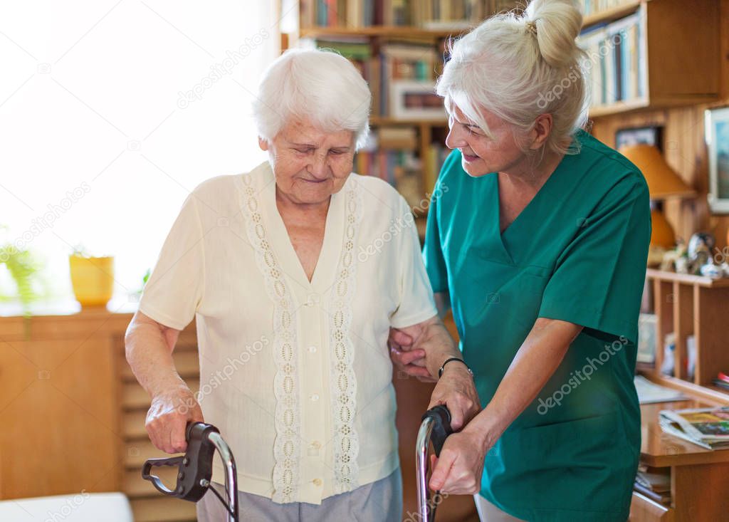 Senior woman with her female caregiver