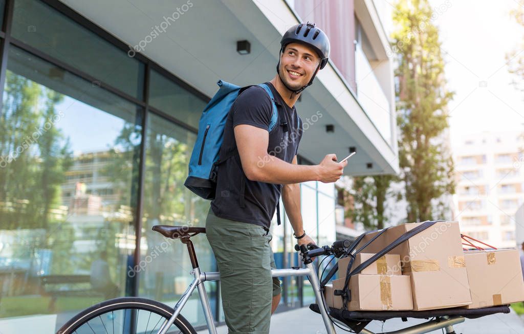 Bicycle messenger making a delivery on a cargo bike