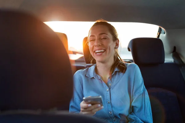 Young Woman Smartphone Back Seat Car — 스톡 사진