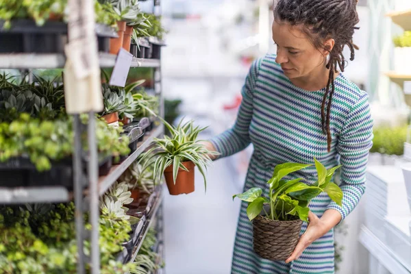 Woman shopping in plant store