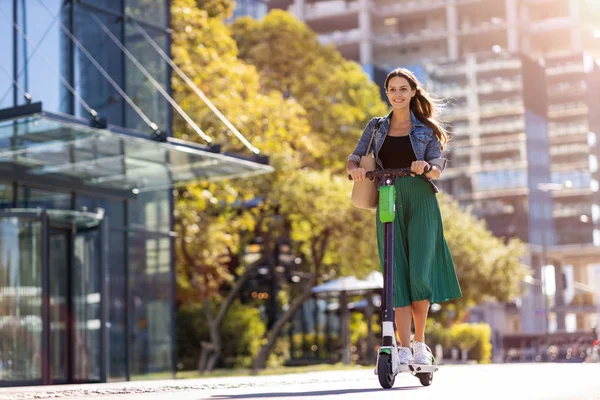 Carefree Young Woman Riding Electric Scooter — Stock Photo, Image