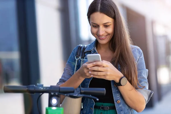 Carefree Young Woman Riding Electric Scooter — Stock Photo, Image