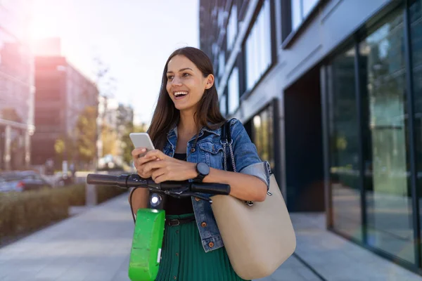 Carefree Young Woman Riding Electric Scooter — Stock Photo, Image
