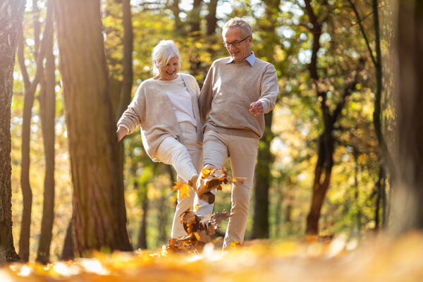 Happy senior couple in autumn park