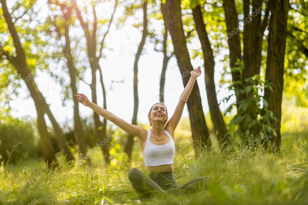 Fit young woman exercising in nature