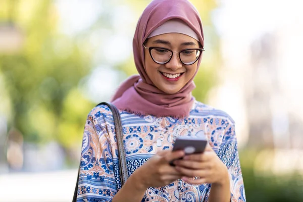 Portrait Confident Young Woman Wearing Hijab Standing Mobile Phone Outdoors Royalty Free Stock Images