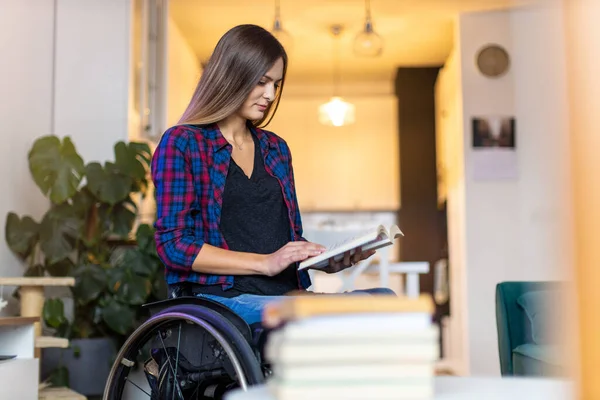 Woman Wheelchair Reading Book Home — Stock Photo, Image