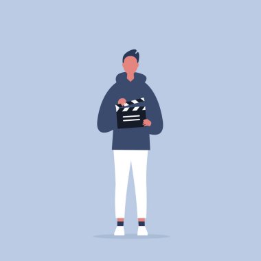 Kamera ekibi. genç asistan bir clapperboard tutarak / düzenleyilebilir f