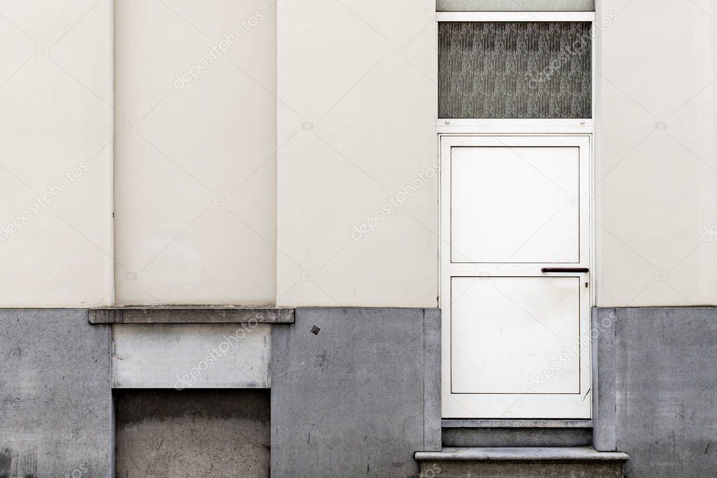 Real urban textures - Old white door n a yellowed wall