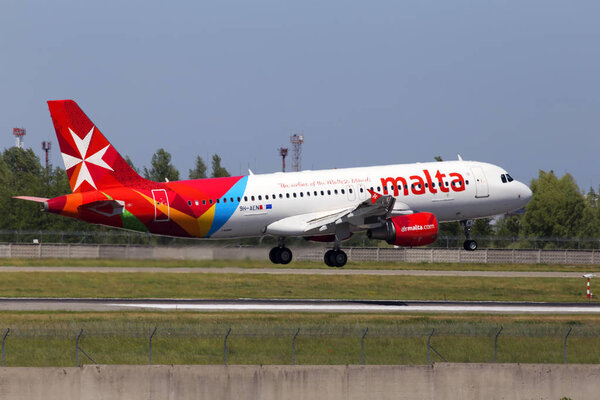 Borispol, Ukraine - May 26, 2018: 9H-AEN Air Malta Airbus A320-200 aircraft landing on the runway of Borispol International Airport. Editorial use only