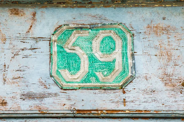 beautiful old door sign with number fifty-nine 59.