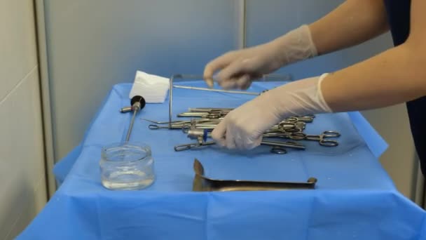 Nurse Rubber Gloves Prepares Sterile Medical Instruments Surgery Table Hands — Stock Video