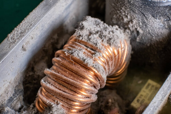 The inductor in the computer power supply is covered with dust