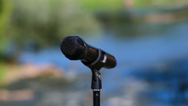 Black Microphone Stand Background Nature River — Stock Video