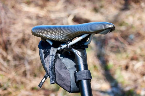 Bike seat pack under bicycle saddle. Small saddle pack attached with velcro