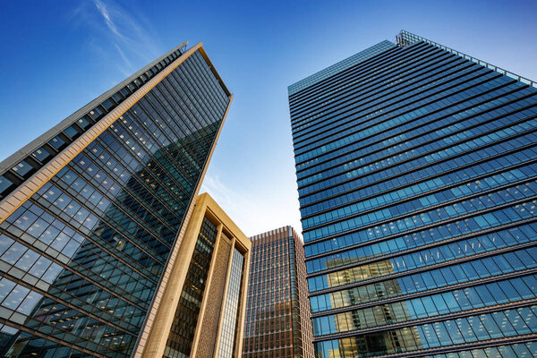 Modern office buildings under a blue sky in Tokyo cit