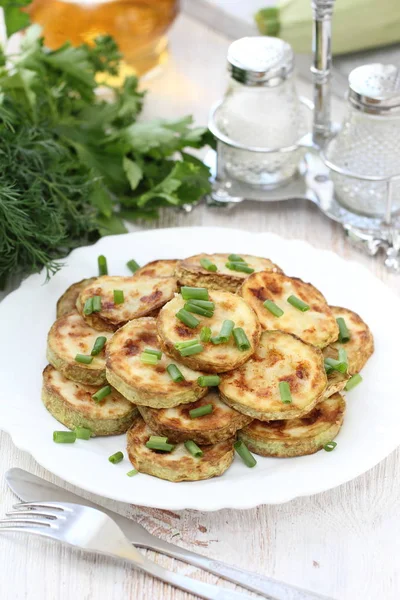 Stock image Fried zucchini on the plate served with spring onion, Vegetarian food