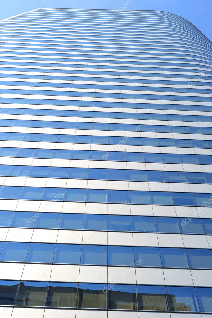 Windows looking out onto the Bangkok skyline.