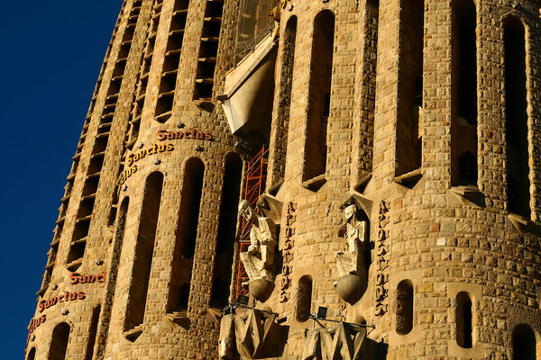 Architecture detail of the Sagrada Familia cathedral at the sun, designed by Antoni Gaudi, in Barcelona, Spain