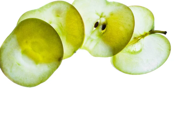 Slices of apple at the backlight isolated on a white background, macro photo Stock Photo