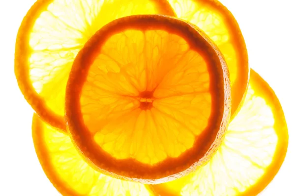 Zamknij grupę plasterków pomarańczy z backlite. makro zdjęcie — Zdjęcie stockowe