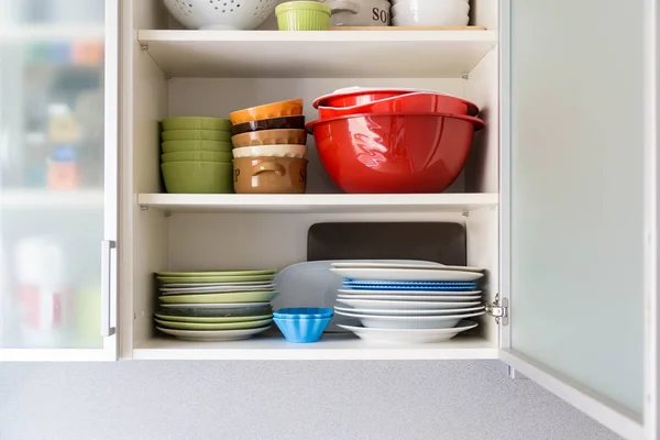 view inside a kitchen cupboard with different dishes