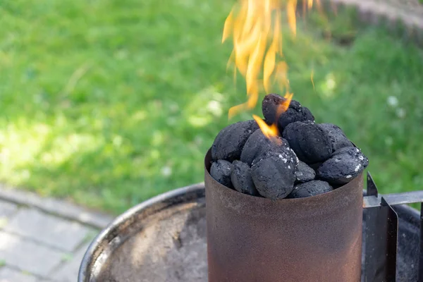 flames out of burning grill charcoal