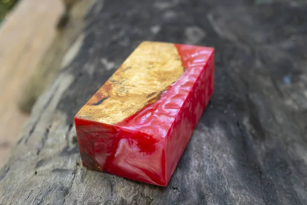 casting epoxy resin Stabilizing Afzelia burl exotic wood red yellow background, Abstract art picture photo, print design and your advertisement, hybrid