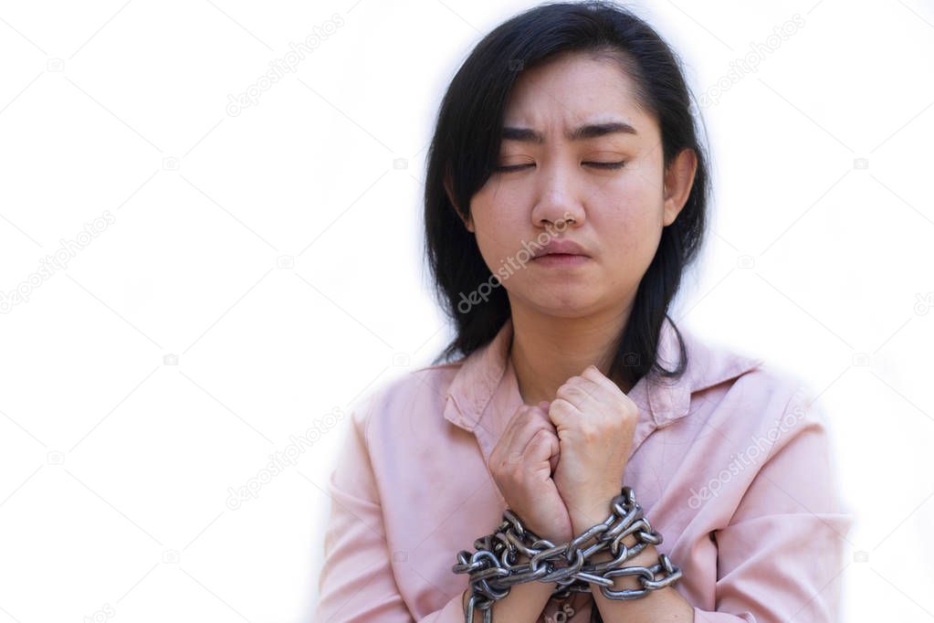 Slave woman hands tied up with steel chain on white background, Human rights violations concept, International Women's Day