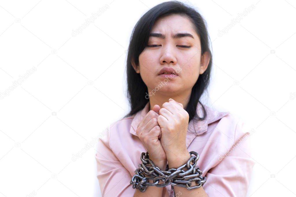 Slave woman hands tied up with steel chain on white background, Human rights violations concept, International Women's Day