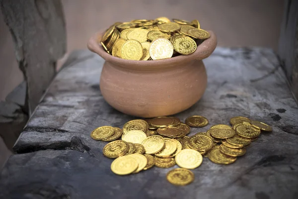 Stacking Gold Coin in jar on wooden with blurred background, Money stack for business planning investment and saving future concep