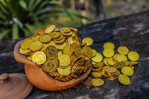 Stacking Gold Coin in jar on wooden with blurred background, Money stack for business planning investment and saving future concep