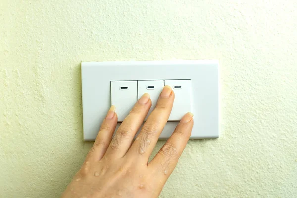 Wet hand turn on lights electric switch, Do not turn the power off while moist hands may electric shock concept