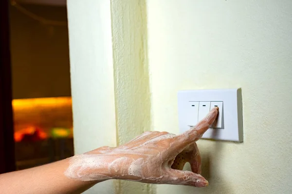 Wet hand turn on lights electric switch, Do not turn the power off while moist hands may electric shock concept