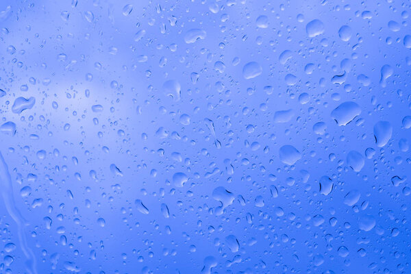 Picture Inside water rain drops on car window glass 