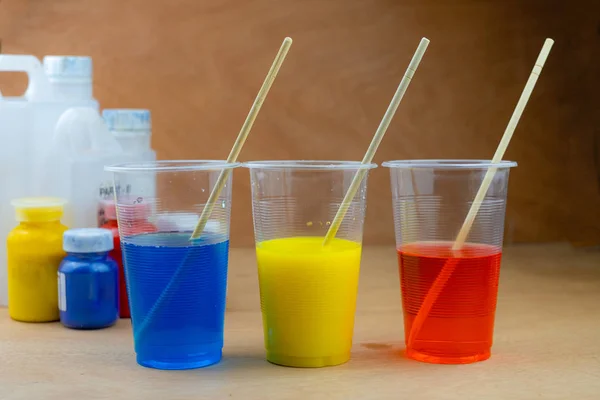 Mixing color epoxy resin in plastic cup — Stock Photo, Image