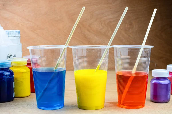 Mixing color epoxy resin in plastic cup — Stock Photo, Image