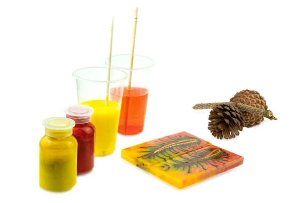 Casting pine cone hybrid and mixing color epoxy resin in plastic — Stock Photo, Image