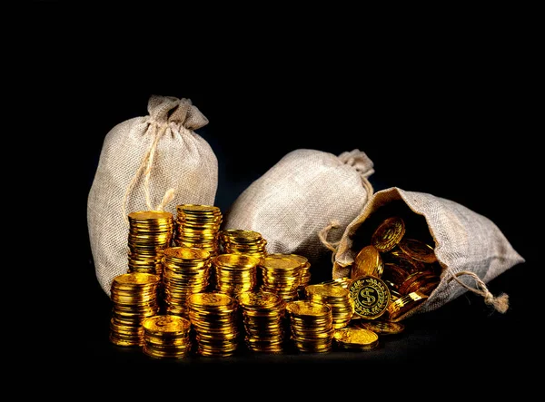 Stacking gold coin in treasure sack