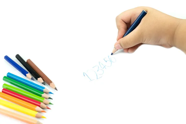 Close up of girl hand with pencil writing english words by hand — Stock Photo, Image