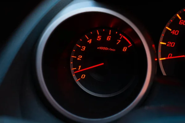 Close up of car speedometer with the needle pointing at  1 krpm Royalty Free Stock Photos