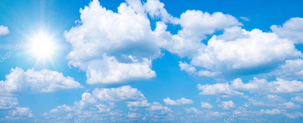 Beautiful blue sky with white clouds and sun